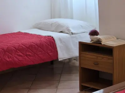 Letto o letti in una camera di Teresa