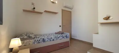 Letto o letti in una camera di Casa indipendente - Residenza Tre Archi
