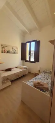 Letto o letti in una camera di Casa indipendente - Residenza Tre Archi