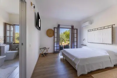 Letto o letti in una camera di Sa Meri B&B