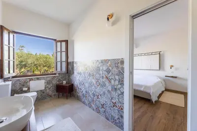 Letto o letti in una camera di Sa Meri B&B