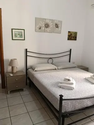 Letto o letti in una camera di Domo Cri&Sa