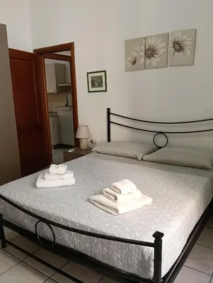 Letto o letti in una camera di Domo Cri&Sa