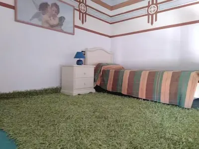 Letto o letti in una camera di Palazzo Spiga