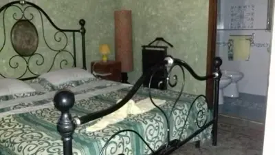 Letto o letti in una camera di Palazzo Spiga