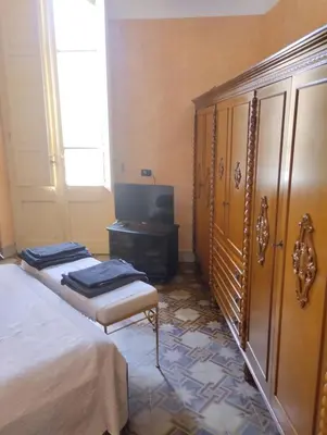 Letto o letti in una camera di Palazzo Spiga