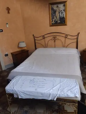 Letto o letti in una camera di Palazzo Spiga