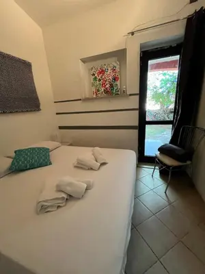Letto o letti in una camera di Namasté Suite - Porto Pino