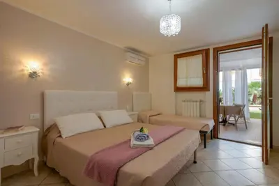 Letto o letti in una camera di Casa Nostra