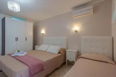 Letto o letti in una camera di Casa Nostra