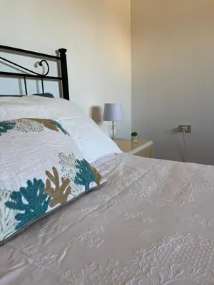 Letto o letti in una camera di DA BARBARINA Casa Vacanze sud Sardegna