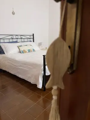 Letto o letti in una camera di DA BARBARINA Casa Vacanze sud Sardegna