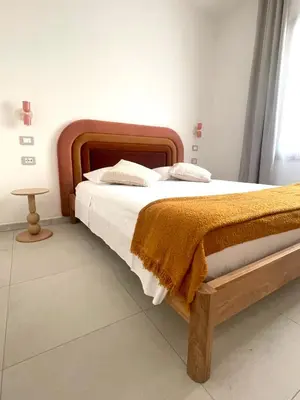 Letto o letti in una camera di Luxi Apartment Teulada