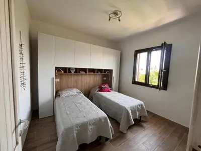 Letto o letti in una camera di Casa Chiara Porto Columbu
