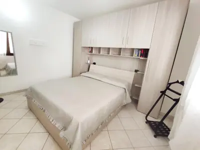 Letto o letti in una camera di Oasi Relax Casa Vacanze Sant'Antioco