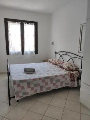 Letto o letti in una camera di Oasi Relax Casa Vacanze Sant'Antioco