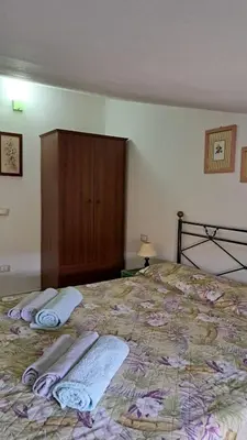 Letto o letti in una camera di Casa del Sole - Trilocale con giardino