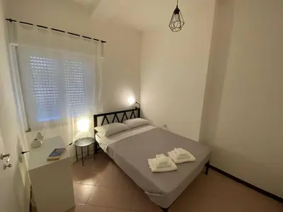 Letto o letti in una camera di Domus Gianni