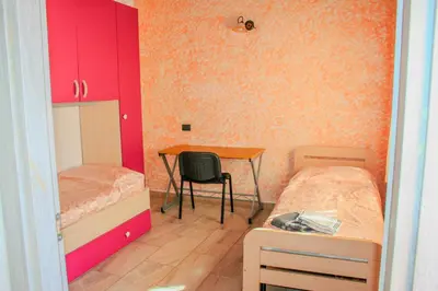 Letto o letti in una camera di Casa Mura