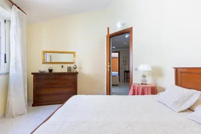 Letto o letti in una camera di GuestHost - La Casa di Gianna