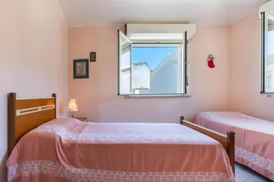 Letto o letti in una camera di GuestHost - La Casa di Gianna