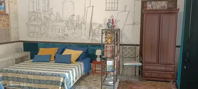 Letto o letti in una camera di Eremo degli Artisti