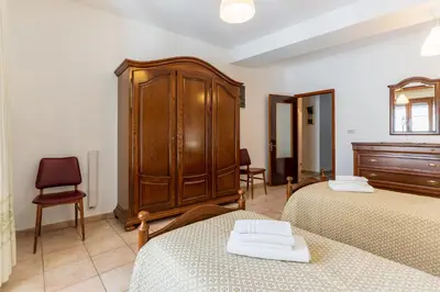 Letto o letti in una camera di Da Zia Vittoria - Affitti Brevi Italia