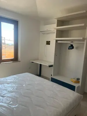 Letto o letti in una camera di NIDO D'AMOREcon vista mare