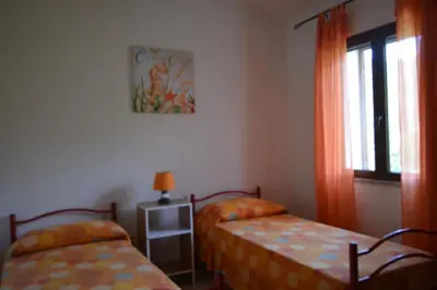 Letto o letti in una camera di Appartamento Panoramico Vista Mare e Montagna