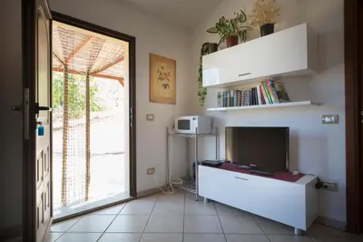 TV o dispositivi per l'intrattenimento presso Appartamento Panoramico Vista Mare e Montagna