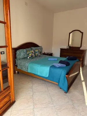 Letto o letti in una camera di Casa Roma