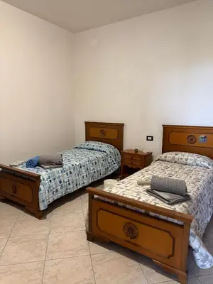Letto o letti in una camera di Casa Roma