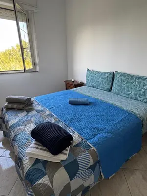 Letto o letti in una camera di Casa Roma