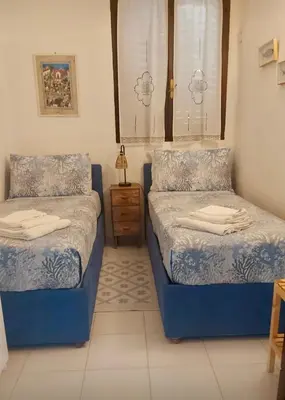 Letto o letti in una camera di Villetta Turchese