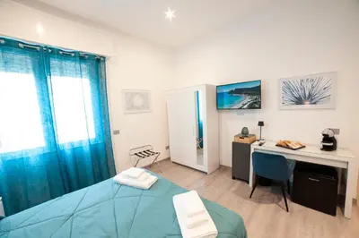 Letto o letti in una camera di Mhometredici Guest House