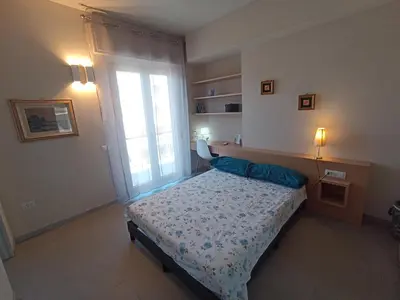 Letto o letti in una camera di Trilocale in centro vicino al parco Monte Urpinu