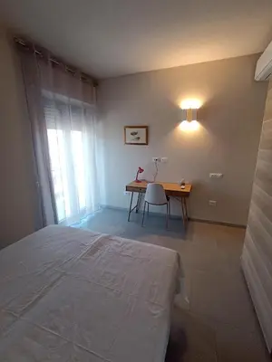 Letto o letti in una camera di Trilocale in centro vicino al parco Monte Urpinu
