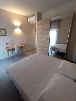 Letto o letti in una camera di Trilocale in centro vicino al parco Monte Urpinu