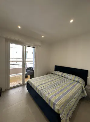 Letto o letti in una camera di Cagliari Rooms