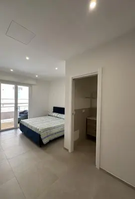 Letto o letti in una camera di Cagliari Rooms
