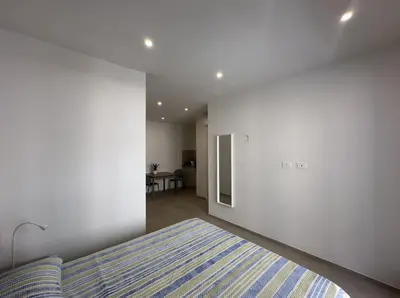Letto o letti in una camera di Cagliari Rooms