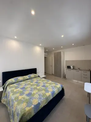 Letto o letti in una camera di Cagliari Rooms