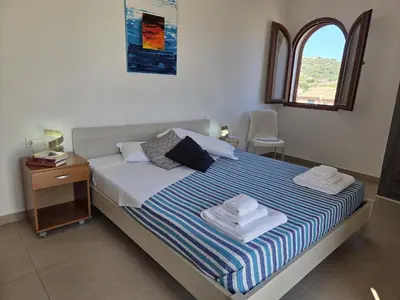 Letto o letti in una camera di Attico La Fenice