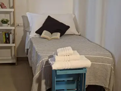 Letto o letti in una camera di Attico La Fenice