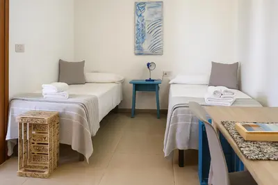 Letto o letti in una camera di Attico La Fenice