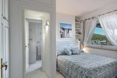 Letto o letti in una camera di Villa Orchidea