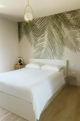 Letto o letti in una camera di Nàlua Sardinia Experience
