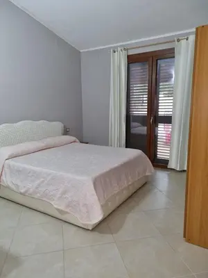 Letto o letti in una camera di Casa Alessia
