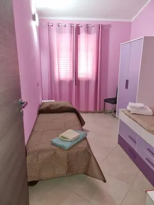 Letto o letti in una camera di Casa Alessia