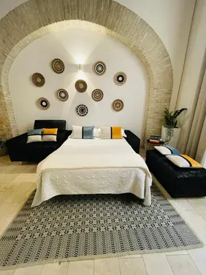 Letto o letti in una camera di CagliariExclusive Marina